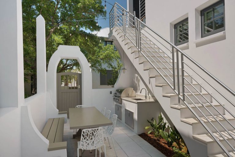 Small transitional courtyard concrete paver patio kitchen photo in Miami with no cover