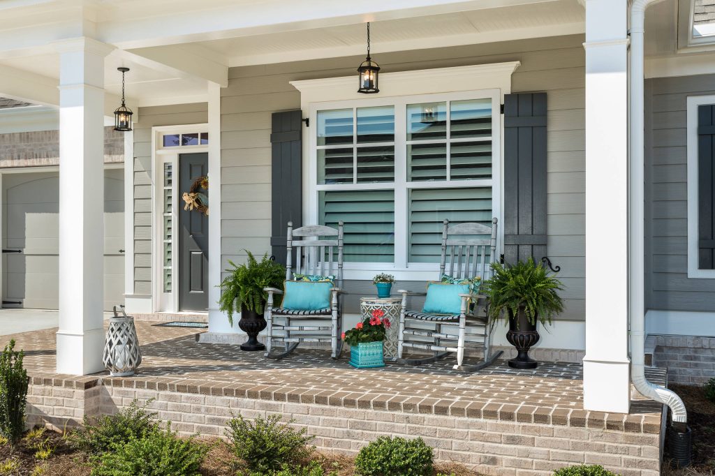Small transitional front porch idea in Atlanta with a roof extension by Bloodfire Studios LLC | Outdoor Photos | Porch | Landscaping | Landscape Design | Outdoor Living Space | Porch Design Ideas | Outdoor Living Space Ideas | Backyard Design
