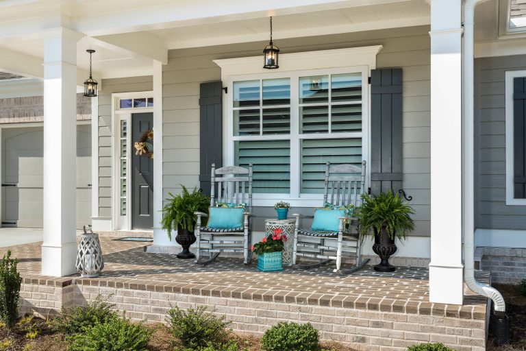 Small transitional front porch idea in Atlanta with a roof extension by Bloodfire Studios LLC | Outdoor Photos | Porch | Landscaping | Landscape Design | Outdoor Living Space | Porch Design Ideas | Outdoor Living Space Ideas | Backyard Design