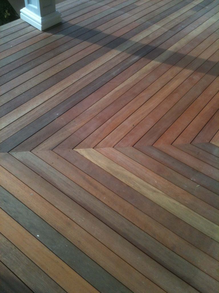 Small transitional front porch photo in New York with decking and a roof extension by Sound Harbor Development, LLC | Outdoor Photos | Porch | Landscaping | Landscape Design | Outdoor Living Space | Porch Design Ideas | Outdoor Living Space Ideas | Backyard Design