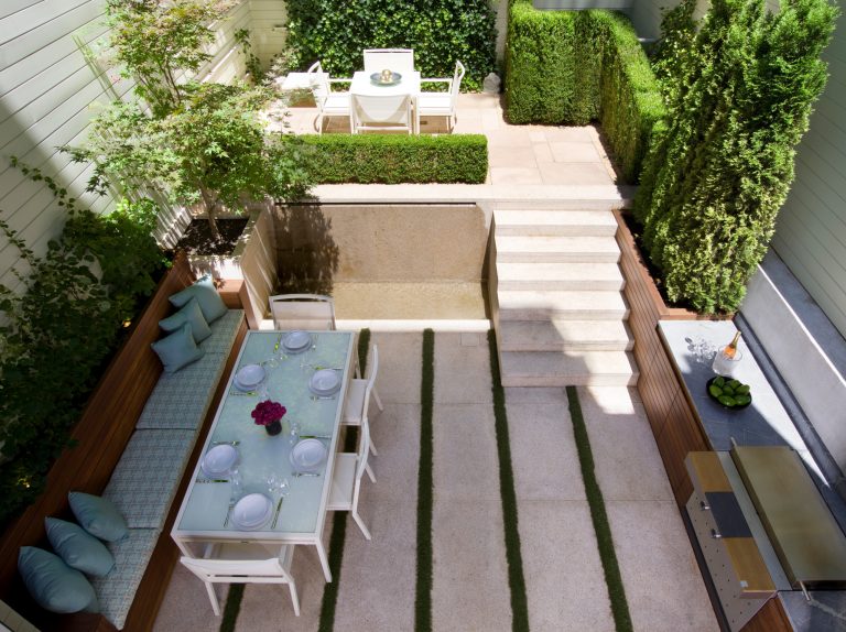 Small trendy backyard concrete patio kitchen photo in New York with no cover