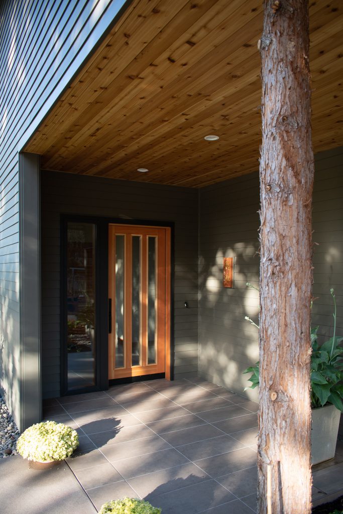 Small trendy tile porch photo in Other with a roof extension by Martin Partners Architecture + Design, LLP | Outdoor Photos | Porch | Landscaping | Landscape Design | Outdoor Living Space | Porch Design Ideas | Outdoor Living Space Ideas | Backyard Design