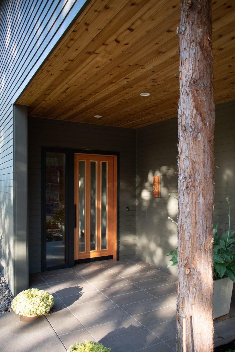 Small trendy tile porch photo in Other with a roof extension by Martin Partners Architecture + Design, LLP | Outdoor Photos | Porch | Landscaping | Landscape Design | Outdoor Living Space | Porch Design Ideas | Outdoor Living Space Ideas | Backyard Design