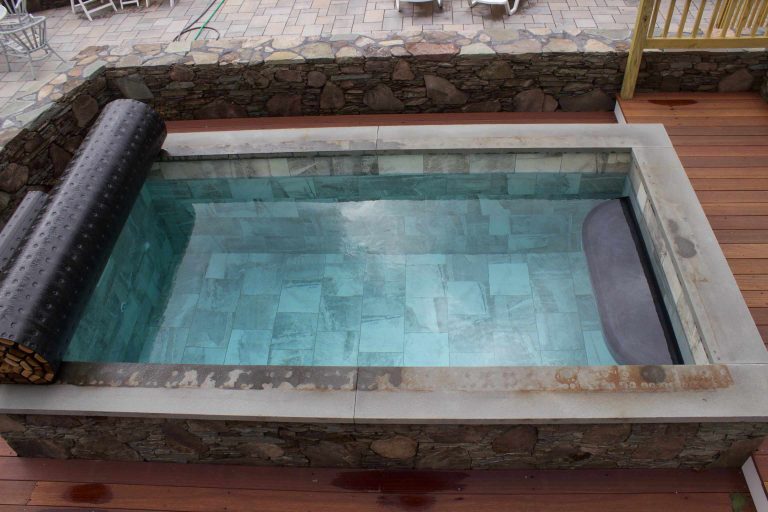 Soake Pool in a private backyard setting. Interesting and beautiful mix of materials and texture was used on wood deck and stone surround. Stone work by Kittery Point Landscaping and Stoneworks by Soake Pools | Pool design | Pool Contracting | Swimming Pool Ideas | Swimming Pool Design Ideas