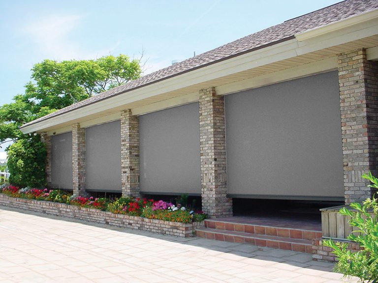 Solar Shades add privacy and sun protection for this front porch.