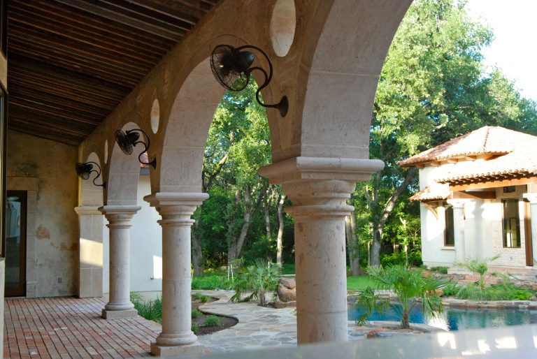 Spacious patio with delightful brick floors and large archways.