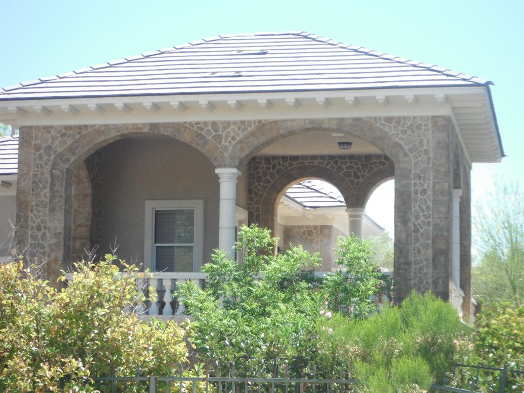 Spray applied, hand carved and colored Mediterranean stucco.