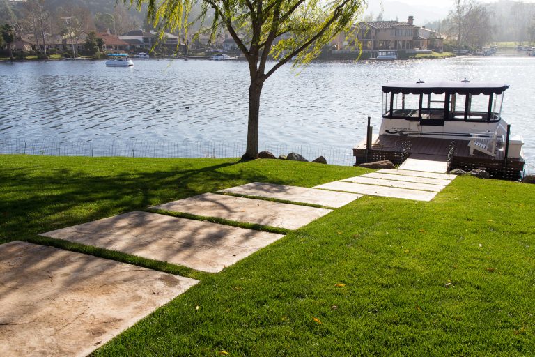 Stamped Concrete slabs make a pathway to the home's dock. Photos by Jannus Studios