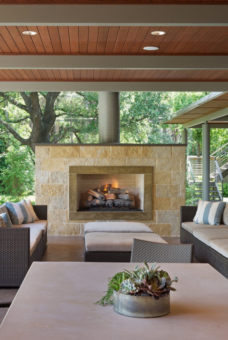 Stone fire place with cast in place concrete surround