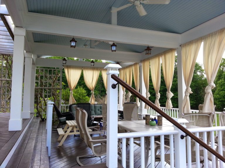 Summer living, dining, and lounge space. Design includes outdoor curtains to help define and make the most of the space throughout the hot summer days. by Christopher Collins | Outdoor Photos | Porch | Landscaping | Landscape Design | Outdoor Living Space | Porch Design Ideas | Outdoor Living Space Ideas | Backyard Design