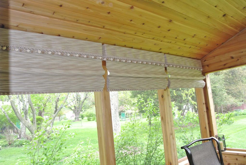 Sunbrella fabric and outdoor trim add a finished look and function to an outdoor sunroom.