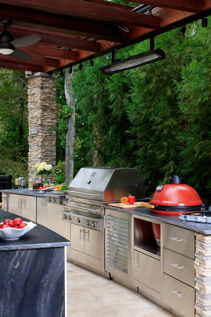 The Built-in Kalamazoo Hybrid Fire Grill is the centerpiece of this outdoor kitchen.