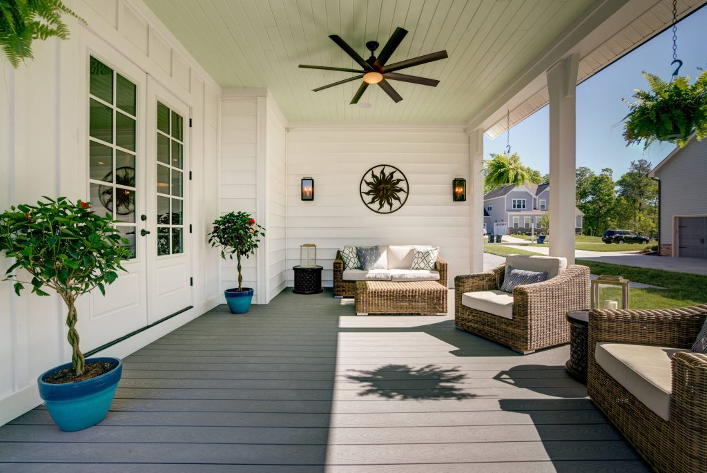 The Potomac's covered porch can handle anything that you throw at it. Composite tongue and groove flooring as well as a painted tongue and groove ceiling provide for a fun atmosphere! by River City Custom Homes | Outdoor Photos | Porch | Landscaping | Landscape Design | Outdoor Living Space | Porch Design Ideas | Outdoor Living Space Ideas | Backyard Design