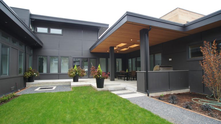 The back of the house has an all grey exterior that lets the modern design speak for itself.