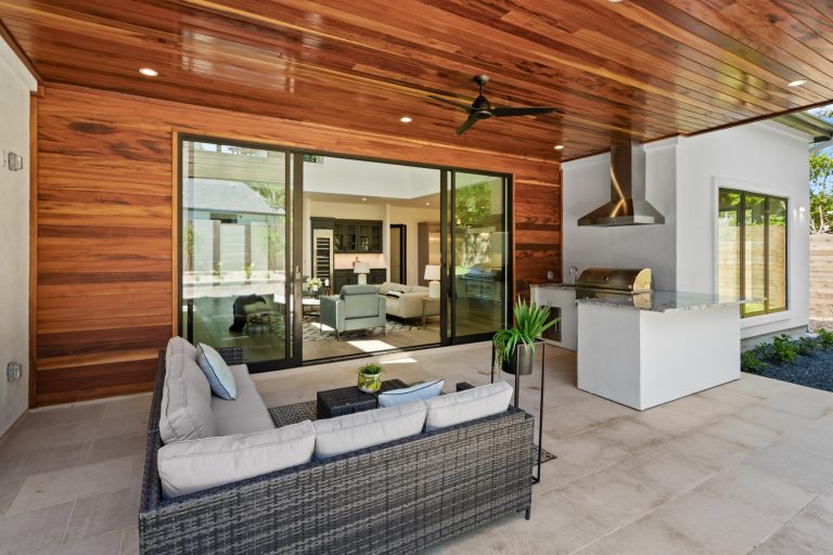 The back porch off of the living room area has a full outdoor kitchen and an intimate space for entertaining.