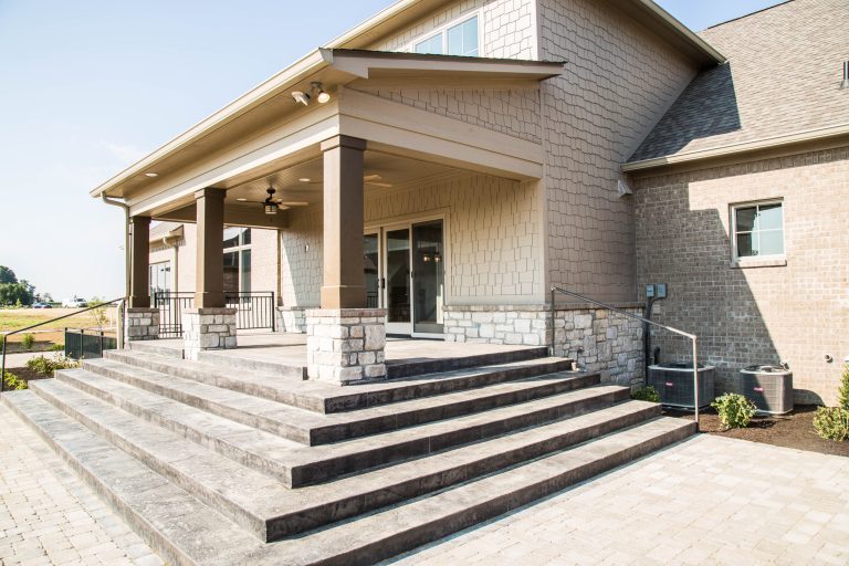 The back porch steps down to a expansive brick patio providing plenty of room for entertaining.