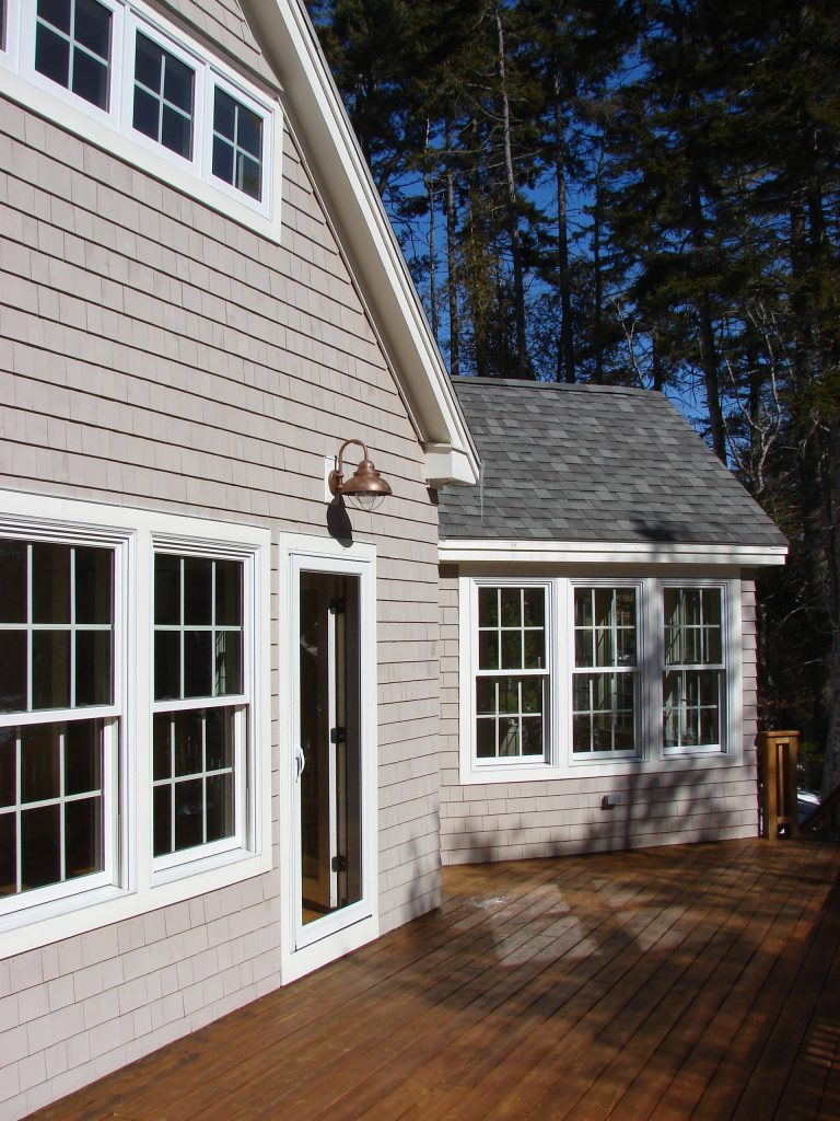 The beautiful cedar deck that leads into the family room. Eric SmithLarge classic back porch idea in Portland Maine with decking and a roof extension by Oceanside Builders, LLC. | Outdoor Photos | Porch | Landscaping | Landscape Design | Outdoor Living Space | Porch Design Ideas | Outdoor Living Space Ideas | Backyard Design