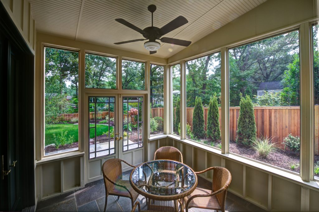 The big glass windows allow for a beautiful view of the surrounding gardens. - Plumb Square Builders