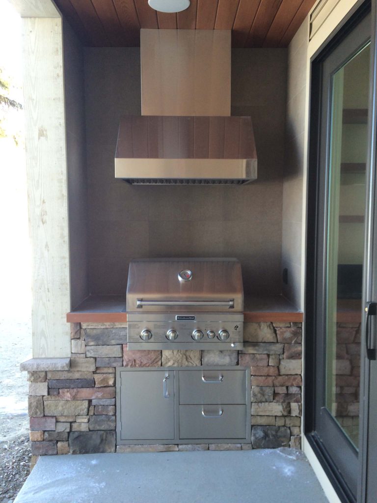 The built-in gas grill and stainless steel hood are protected by an open porch. There is porcelain tile surround for easy cleaning. The chef can see the kids playing in the lake! by Bickford Construction Corporation | Outdoor Photos | Porch | Landscaping | Landscape Design | Outdoor Living Space | Porch Design Ideas | Outdoor Living Space Ideas | Backyard Design