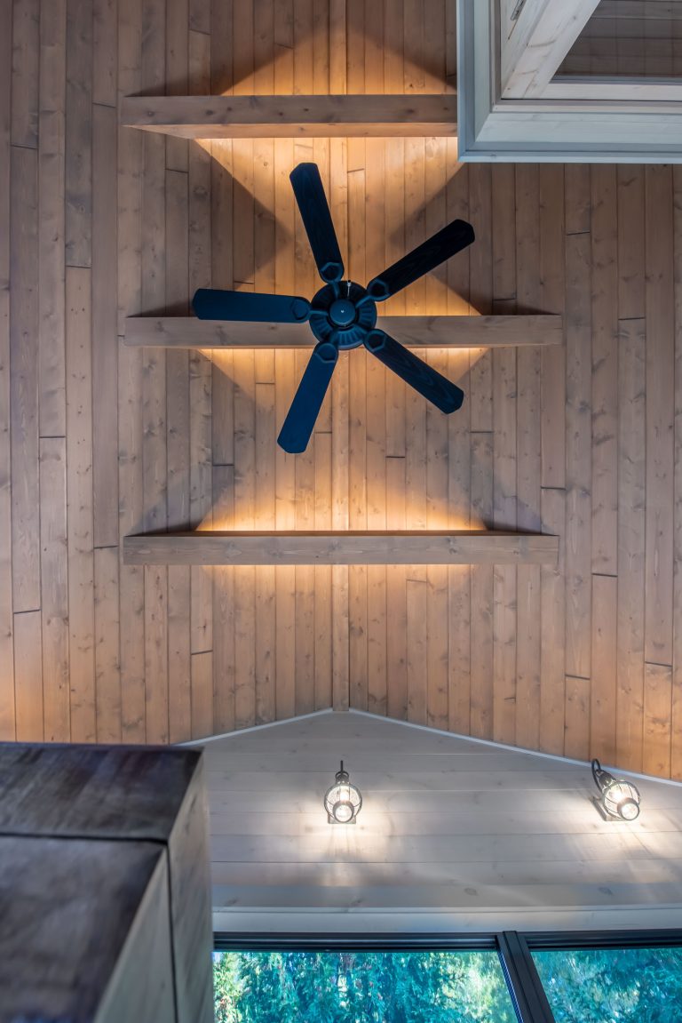 The collar ties have uplighting on them, creating a pattern and a ceiling glow.