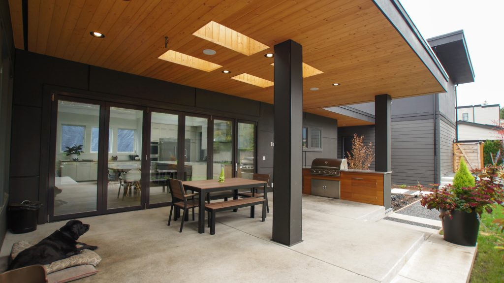 The covered patio and built-in barbecue make the backyard perfect for outdoor living.