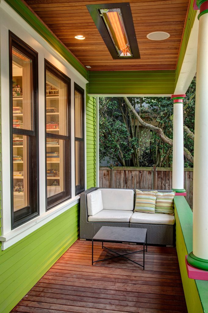 The cozy front porch has a built-in ceiling heater to help socializing in the cool evenings John Wilbanks Photography