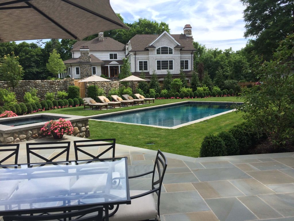 The free standing fieldstone walls in the background provide screening and sound barrier from the front courtyard. The terrace is bluestone.

Magic Landscaping, Inc- New Jersey Landscape Designer & Contractor. by Magic Landscaping, Inc. | Pool design | Pool Contracting | Swimming Pool Ideas | Swimming Pool Design Ideas