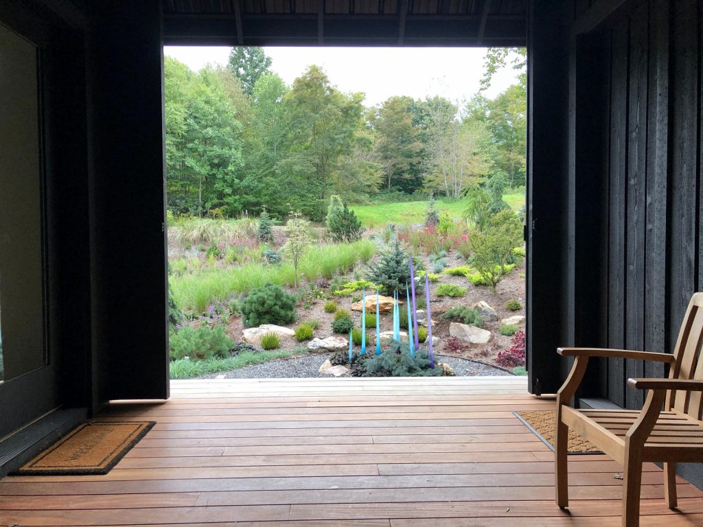 The front garden, 10 months old, as seen through the barn doors on the dogtrot.