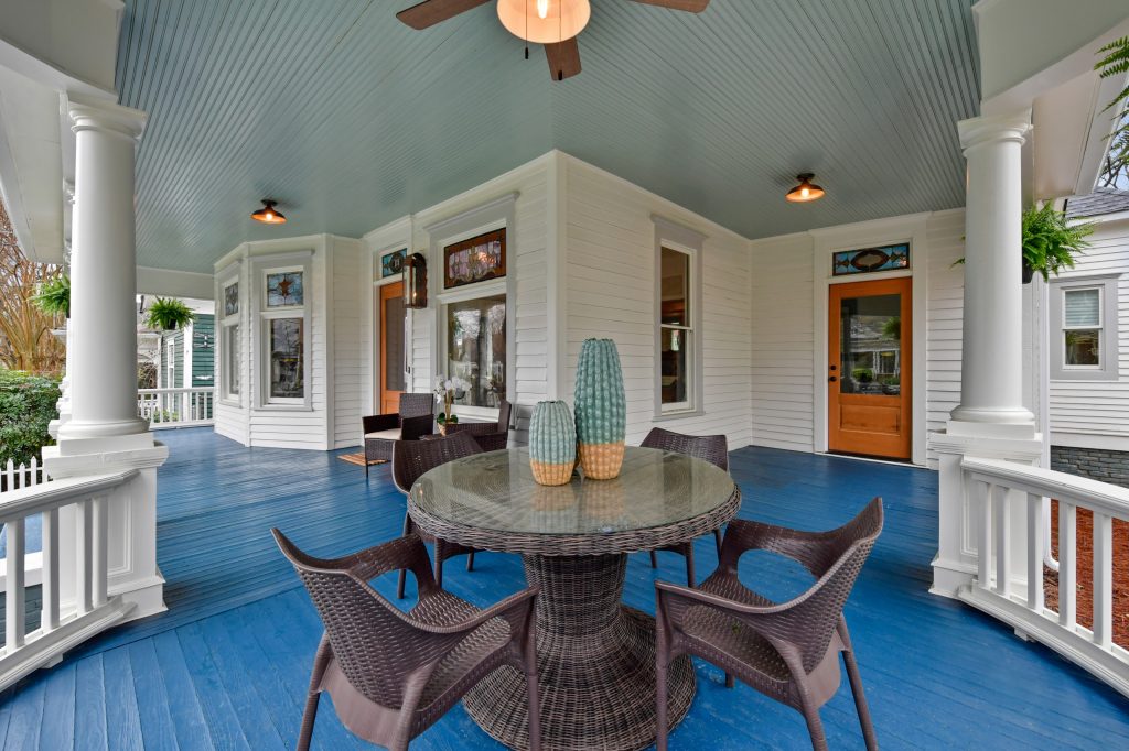 The front porch had not been used for 40 years. Now, it can be used daily for dining and more!
