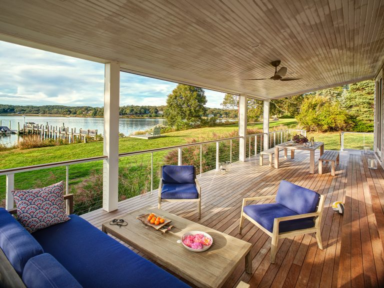 The generous back porch facing the bay was reconfigured—structural beams supporting the roof were raised—to improve the view of the bay.