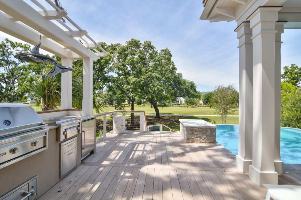 The grilling area features a trellis over the outdoor kitchen and high quality outdoor appliances. Tripp Smith