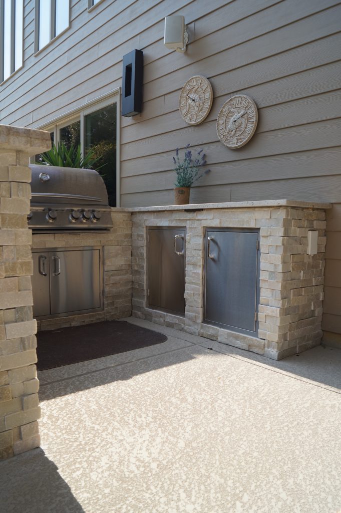 The light colored stone and granite complement the existing materials of the space | Green Guys
