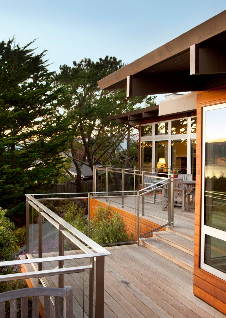 The new Ipe deck now wraps around the house zigzagging to match the house’s contours while creating areas for sitting and continues all the way back to the living room. Photo Credit: Paul Dyer Photography by ODS Architecture | Outdoor Photos | Porch | Landscaping | Landscape Design | Outdoor Living Space | Porch Design Ideas | Outdoor Living Space Ideas | Backyard Design