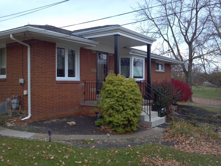 The new porch roof structure using custom aluminum railings and columns. New concrete steps were installed. All trims and underside was built using low maintenance products. by Diamond Construction & Remodeling, Inc | Outdoor Photos | Porch | Landscaping | Landscape Design | Outdoor Living Space | Porch Design Ideas | Outdoor Living Space Ideas | Backyard Design