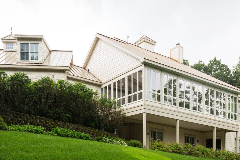 The open, covered deck was converted to a large wrap-around 4-season living space. Abundance of windows and natural light. Attic addition is now a quilting room, also enjoying daylight. by Showcase Renovations, Inc. | Outdoor Photos | Porch | Landscaping | Landscape Design | Outdoor Living Space | Porch Design Ideas | Outdoor Living Space Ideas | Backyard Design