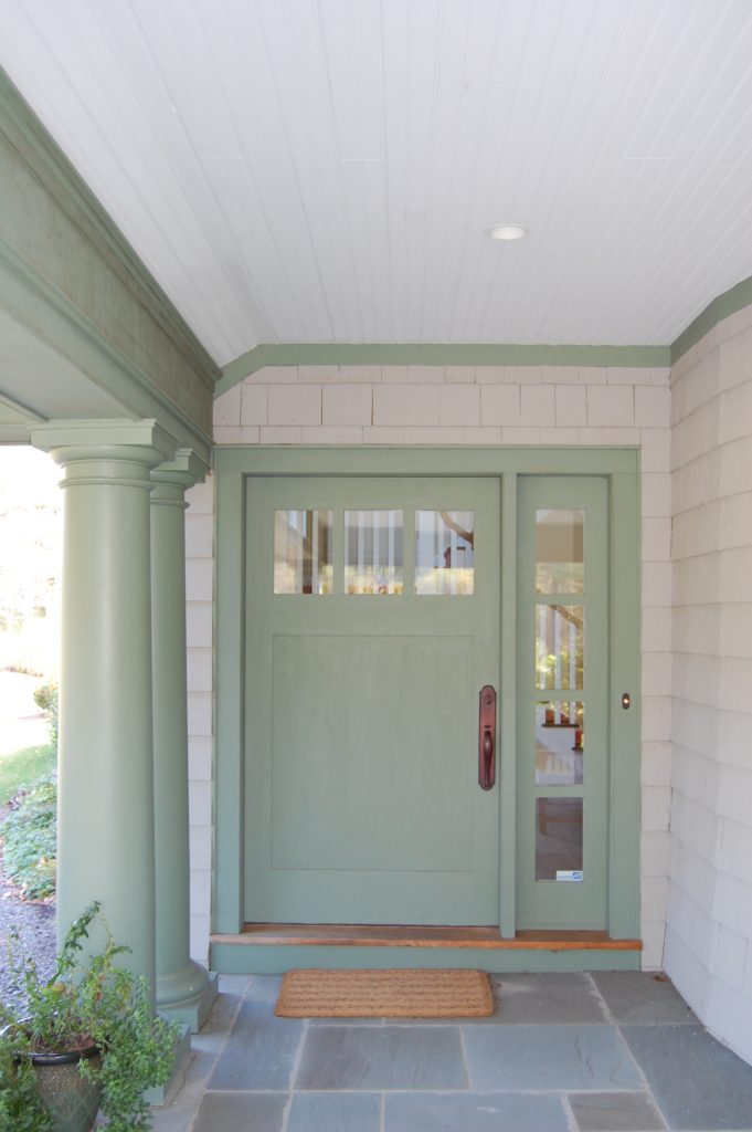 The outdoor shower was designed to integrate into the stone veneer wall and be accessible from the Lower Level.