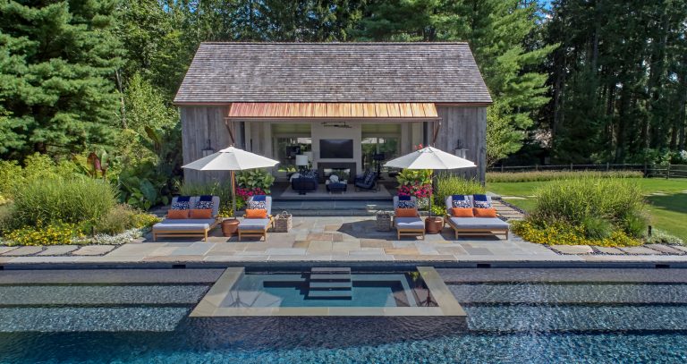 The pool features a submerged spa and gradual entry platforms. Robert Benson Photography.
