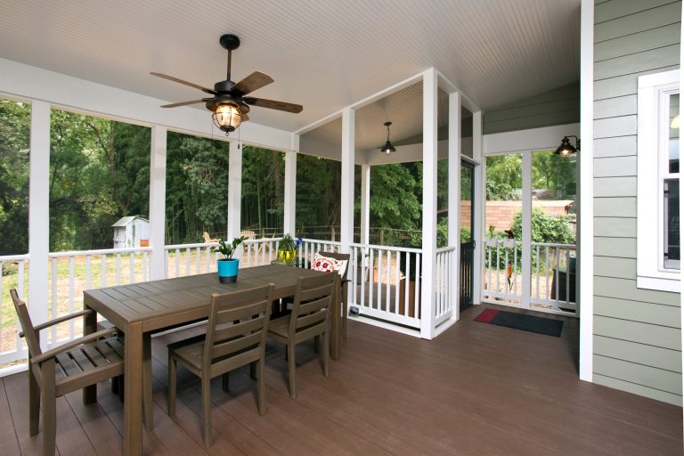 The screened-in porch addition on this Cape Cod styled home keeps the bugs out and the fresh air in. A lighted ceiling fan is a great feature to keep diners cool. by MARK IV Builders, Inc | Outdoor Photos | Porch | Landscaping | Landscape Design | Outdoor Living Space | Porch Design Ideas | Outdoor Living Space Ideas | Backyard Design