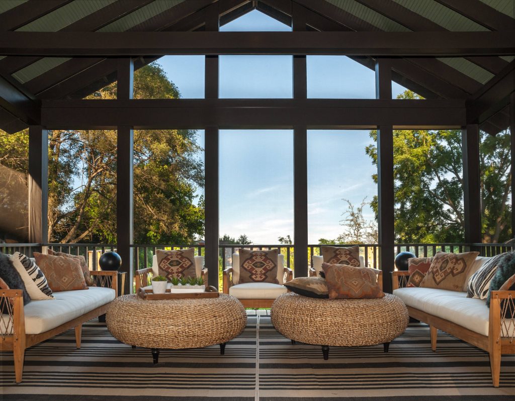 The screened porch is an inviting, casual space. Contractor: Maven Development Photo: Emily Rose Imagery