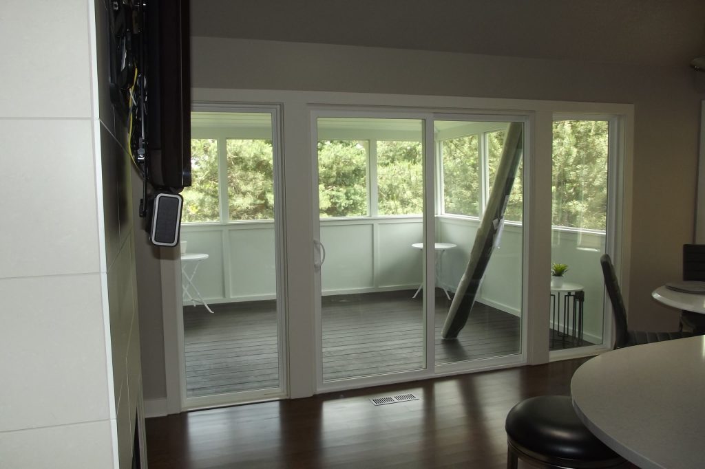 The space was changed from one small door into a large sliding doo and big side windows. Opening up the space and increasing the usability of the porch. by Morgan Wightman Supply Co | Outdoor Photos | Porch | Landscaping | Landscape Design | Outdoor Living Space | Porch Design Ideas | Outdoor Living Space Ideas | Backyard Design