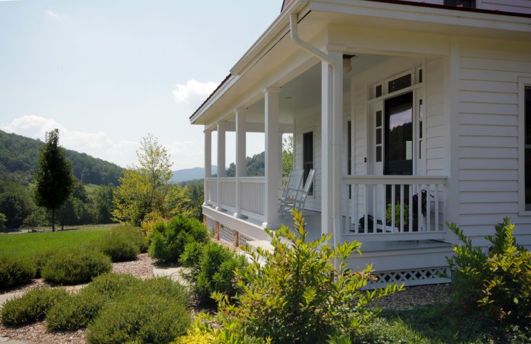 The welcoming front porch wraps around to the front.