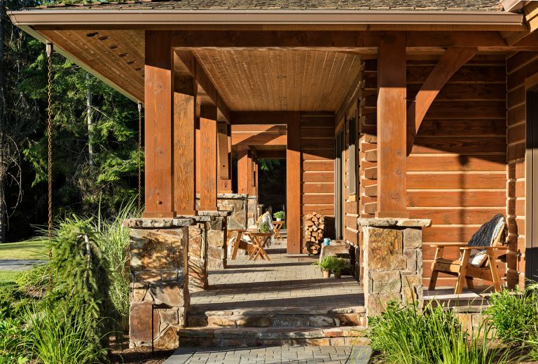 The wrap-around-patio is a great place to soak in the scenery and admire the home's log and timber frame construction. Photography by: Longviews Studios, Inc. by M.T.N Design | Outdoor Photos | Porch | Landscaping | Landscape Design | Outdoor Living Space | Porch Design Ideas | Outdoor Living Space Ideas | Backyard Design