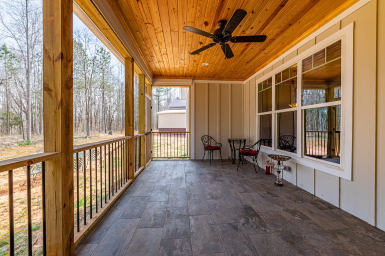 This Craftsman-style home in North Carolina boasts a multitude of single-hung vinyl windows. The windows all have "drop" or "Craftsman" grids.