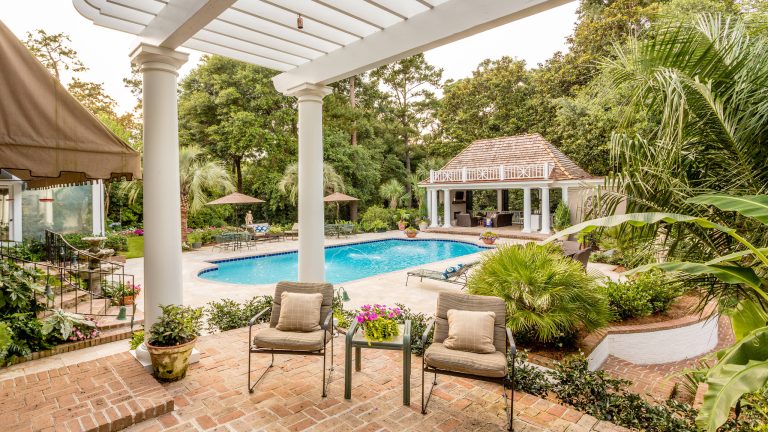 This aging pool pavilion was given new life and is now the focal point for this traditional Fairhope home.