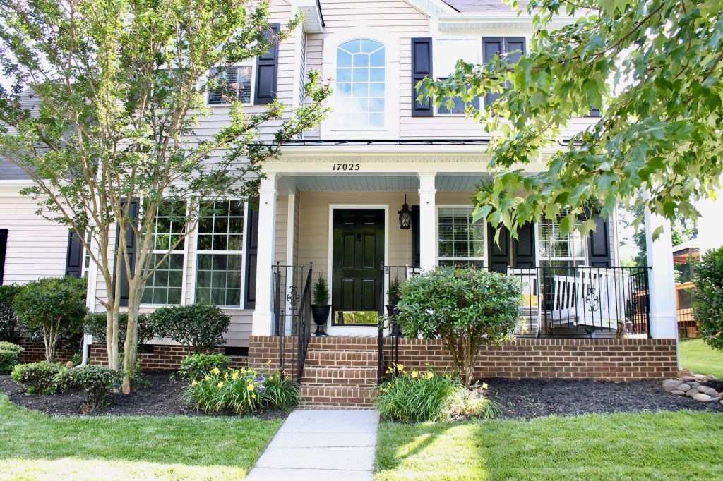 This beautiful front porch features owners children's crib transformed swing! What a wonderful way to repurpose at the same time to reminisce some old time. by CR Interior Design | Outdoor Photos | Porch | Landscaping | Landscape Design | Outdoor Living Space | Porch Design Ideas | Outdoor Living Space Ideas | Backyard Design