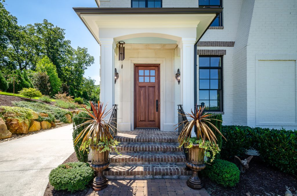 This beautiful house was lacked a porch that drew you to the front door. We added the front porch and matched the existing house.