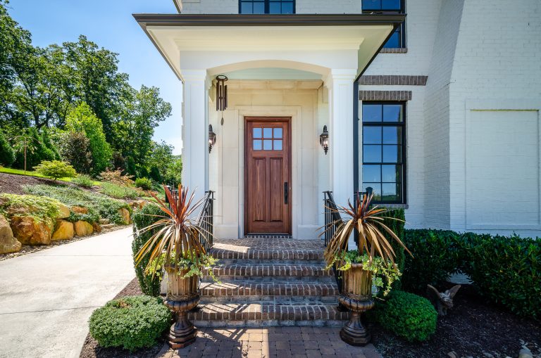This beautiful house was lacked a porch that drew you to the front door. We added the front porch and matched the existing house.