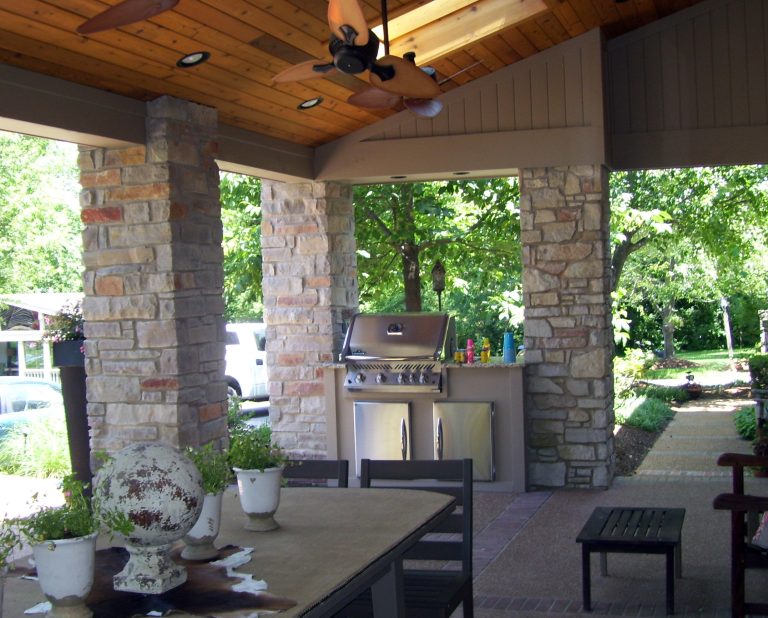 This built in grill area is nestled between two masonry columns on the end of a coverd patio. It also has storage cabinets below for tools and supplies.