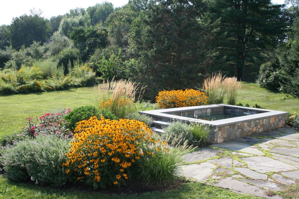 This concrete plunge pool installation and finish work involved a collaboration between Soake Pools and Woodburn and Company.