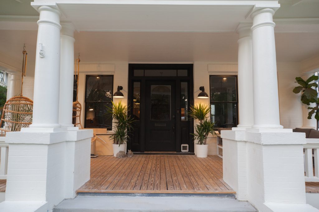 This exterior remodel is an absolutely stunning example of Modern Farm House style meets Hyde Park.